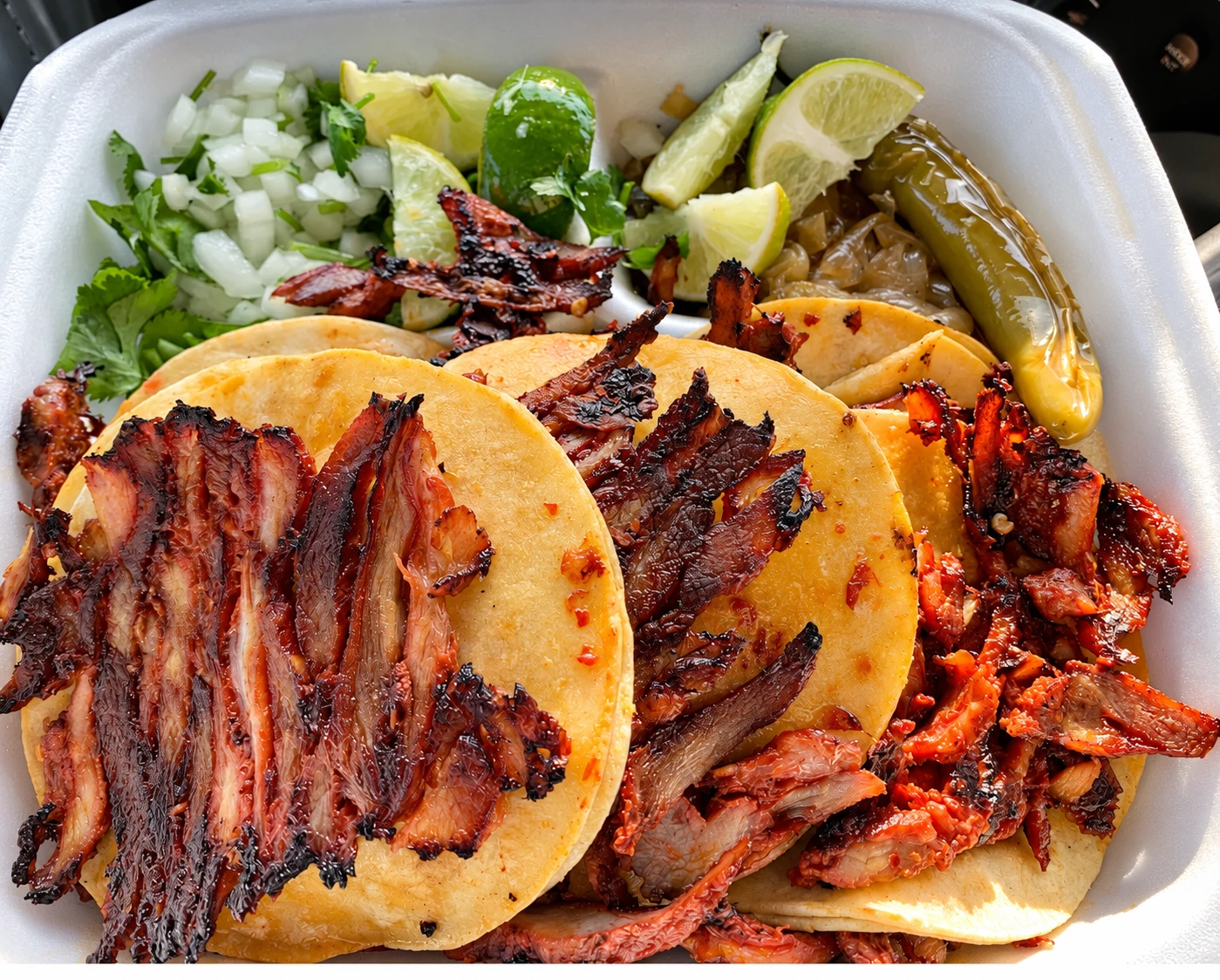 Enhanced photograph of TACOS trompo tacos and sauces